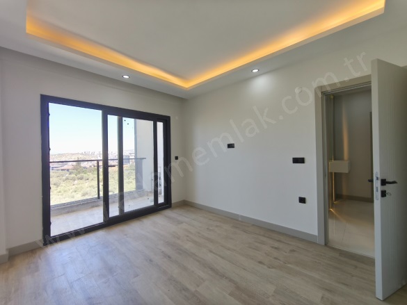 Değirmendere Mah. Kuşadası Satılık Daire |  2+1 Oda | 94M2 6.000.000Tl | Zemin Kat | Yerden Isıtma | 1 Banyo | 2 Yatak Odası Resim-5