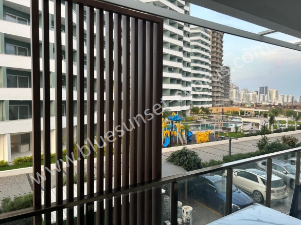 Long Beach İskele Satılık Daire |  1 Oda | 50M2 90.000£ Eşyalı  | 1. Kat | Klima | 1 Banyo | 1 Yatak Odası Resim-4