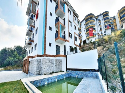 Kuşadası Türkmende Satılık Daire 1+1 Havuzlu Site İçinde Doğa İle İç İçe Deniz Manzaralı Türkmen Mah