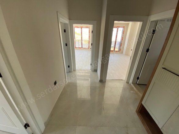 Sahil Mah-Küçükkuyu Köyü. Ayvacık Satılık Daire |  2+1 Oda | 100M2 6.000.000Tl  Krediye Uygun  | 1. Kat | Kat Kaloriferi | 2 Banyo | 2 Yatak Odası Resim-1