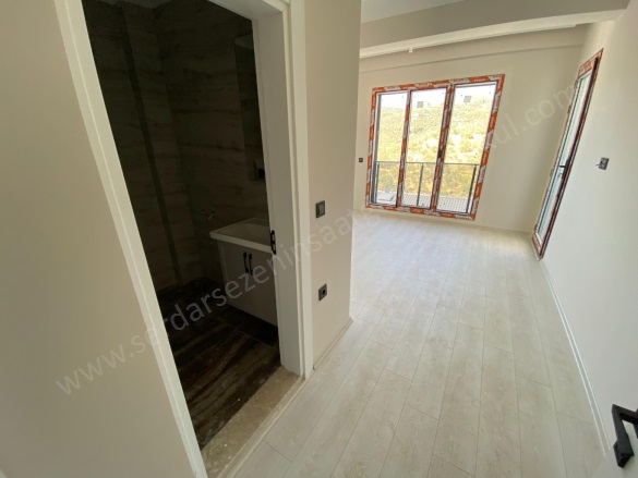 Sahil Mah-Küçükkuyu Köyü. Ayvacık Satılık Daire |  2+1 Oda | 100M2 6.000.000Tl  Krediye Uygun  | 1. Kat | Kat Kaloriferi | 2 Banyo | 2 Yatak Odası Resim-5