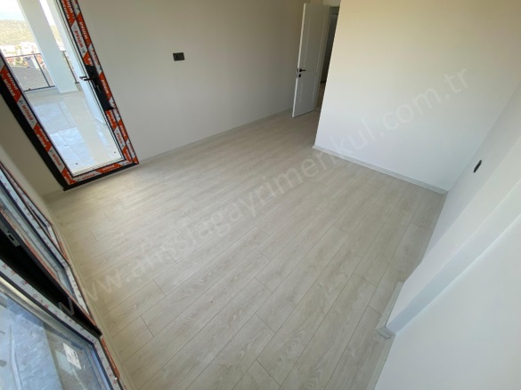 Sahil Mah-Küçükkuyu Köyü. Ayvacık Satılık Daire |  2+1 Oda | 95M2 6.500.000Tl  Krediye Uygun  | 1. Kat | Kat Kaloriferi | 2 Banyo | 2 Yatak Odası Resim-5