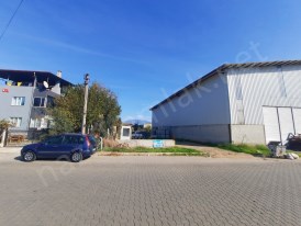 Organize sanayi yolu üzeri kiralık etrafı çevrili arsa, depo..