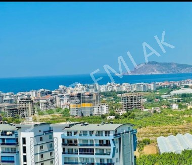 Alanya Mahmutlarda dağ ve deniz manzaralı 1+1 satılık daire