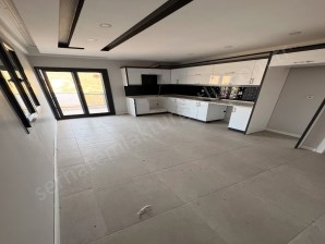 TURGUTLU KİRALIK ERGENEKON MAH 130M2 3+1 ODA 4. KAT ASANSÖRLÜ YERDEN ISITMA OTOPARKLI BALKONLU SIFIR