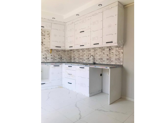 TURGUTLU SATILIK İSTİKLAL MAH 3. KAT 100M2 2+1 ODA YERDEN ISITMA ASANSÖRLÜ BALKONLU SIFIR DAİRE 
