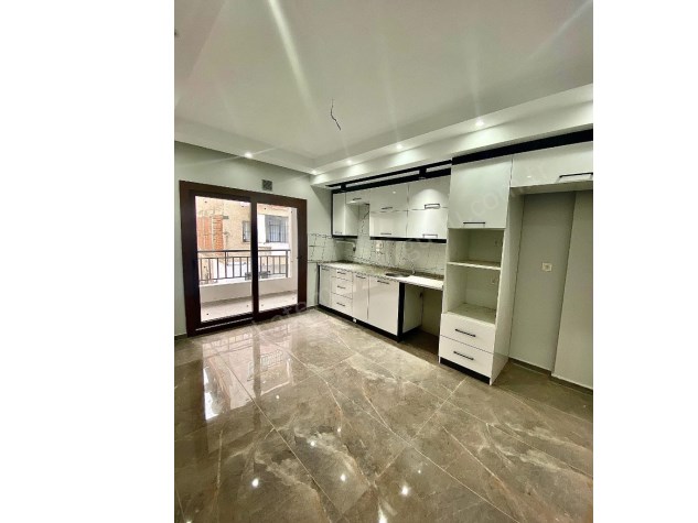 TURGUTLU SATILIK ÖZYURT MAH SIFIR DAİRELER 1.VE 2. KAT OTOPARKLI DOĞALGAZLI BALKONLU 115M2 2+1 ODA 