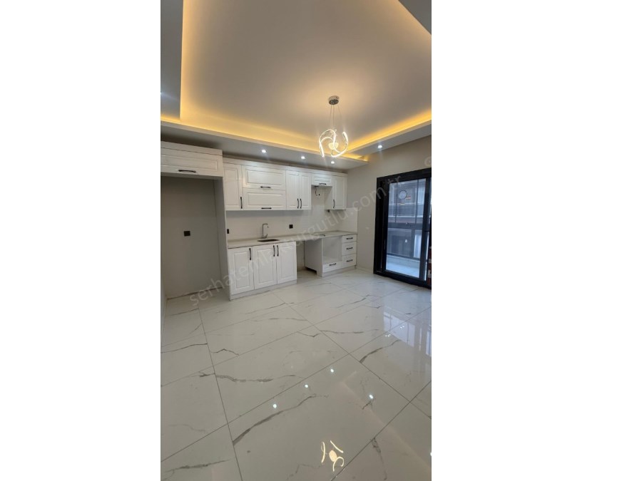 TURGUTLU SATILIK ACARLAR MAH SIFIR 2 ADET 2+1  DAİRE  1. VE 3. ARA KAT YERDEN ISITMA ASANSÖR OTOPARK