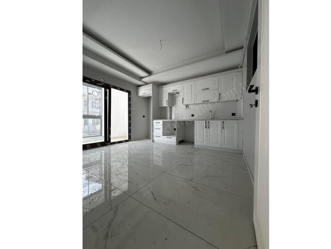 TURGUTLU SATILIK ACARLAR MAH SIFIR 3.ARA KAT DAİRE 2+1 ODA 100M2 OTOPARK ASANSÖR YERDEN ISITMA 