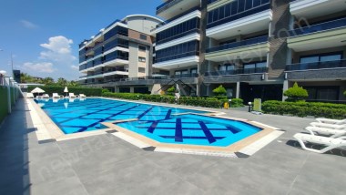 PREISWERTE STRANDNAHE 2-ZIMMER-WOHNUNG MIT KLEINEM MEERBLICK UND POOLBLICK – IN KARGICAK/ALANYA
