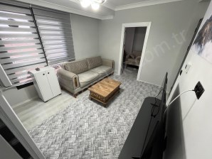 ÜNALAN MAHALLESİNDE SIFIR EŞYALI 2+0 BALKONLU KİRALIK APART