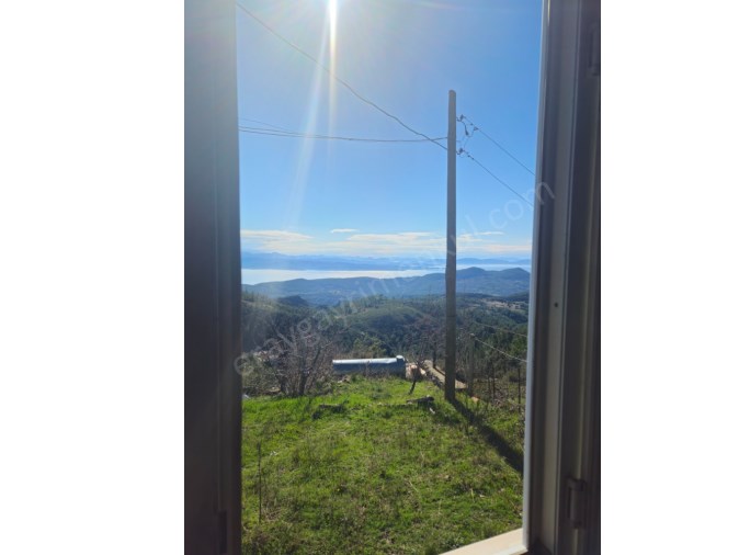 MUĞLA DA EV TAKASLI FUL DENİZ MANZARALI SATILIK EV VE ARSASI 